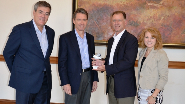 Danfoss presented its fifth annual EnVisioneer of the Year award to Daikin Applied for its Magnitude watercooled chillers which use Danfoss Turbocor compressor technology to offer industryleading partload efficiency that exceeds standards and provides significant lifetime cost savings Pictured from left are Ricardo Schneider president and chief executive officer Danfoss Turbocor Mike Schwartz chief executive officer Daikin Applied Americas John Galyen president Danfoss North America and Lisa Tryson directo