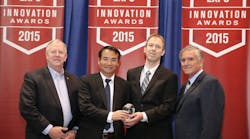 ASHRAE President Thomas H. Phoenix (left) and Air-Conditioning, Heating, and Refrigeration Institute Chairman Ed Purvis (right) congratulate Lin Sun and Mogens Rasmussen of Danfoss on receiving the 2015 AHR Expo Product of the Year award.