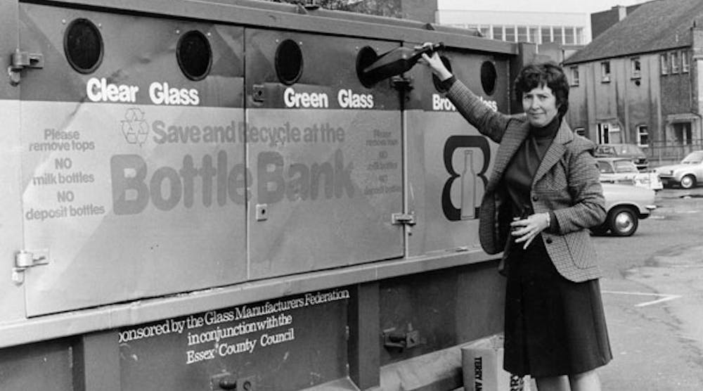 In this 1976 photo, a woman recycles glass at a bottle bank in Chelmsford, England. (Photo by Evening Standard/Getty Images)