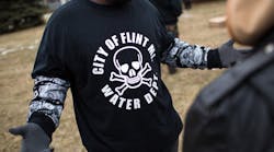 A shirt worn by a man during a rally at Flint City Hall in Flint, Mich., on Jan. 24, 2016, displays a poisonous logo alongside the text &apos;City of Flint MI Water Dept.&apos; The event was organized by Genesee County Volunteer Militia to protest government corruption the group sees in relation to the Flint water crisis, which resulted in a federal state of emergency. (Photo by Brett Carlsen/Getty Images)