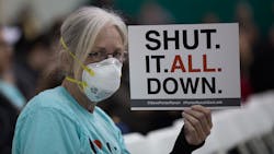 A woman holds a sign while attending a public hearing before the South Coast Air Quality Management District regarding a proposed stipulated abatement order to stop the naturalgas leak in Granada Hills near Porter Ranch Calif on Jan 16 2016 Photo by David McNewGetty Images A woman holds a sign while attending a public hearing before the South Coast Air Quality Management District regarding a proposed stipulated abatement order to stop the naturalgas leak in Granada Hills near Porter Ranch Calif on Jan 16 2016 Photo by David McNewGetty Images