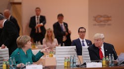 German Chancellor Angela Merkel and U.S. President Donald Trump attend the morning working session on the second day of the G20 economic summit in Hamburg, Germany, July 8, 2017. G20 leaders reportedly agreed on trade policy, but disagreed over climate-change policy. (Photo by Sean Gallup/Getty Images)