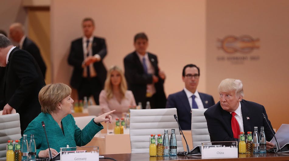 German Chancellor Angela Merkel and U.S. President Donald Trump attend the morning working session on the second day of the G20 economic summit in Hamburg, Germany, July 8, 2017. G20 leaders reportedly agreed on trade policy, but disagreed over climate-change policy. (Photo by Sean Gallup/Getty Images)