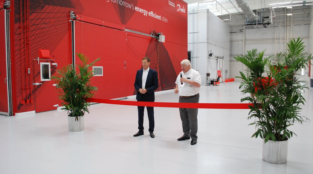 Kim Fausing, who took over as Danfoss&rsquo; chief executive officer July 1, (left) and Jorgen M. Clausen, Danfoss&rsquo; chairman of the board, inaugurate the new Application Development Center with a ribbon-cutting ceremony.