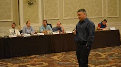 Danfoss Sales Director Peter Dee leads a panel discussion at the Refrigerants2Sustainability symposium Sept. 27 in Orlando. Fla.