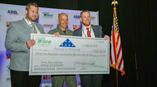 Taco&rsquo;s John White III and Ben White present Major Dan Rooney with a check from Taco Comfort Solutions at the 2018 Eastern Energy Expo in Mashantucket, CT.