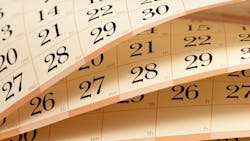 Flipping through the pages of a calendar representing HVACR training and events Flipping through the pages of a calendar representing HVACR training and events