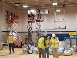 Contractors rework lighting and HVAC to convert a hospital gymnasium at the Bergen County New Bridge Medical Center in Paramus, NJ, some 15 miles from NYC. Contractors rework lighting and HVAC to convert a hospital gymnasium at the Bergen County New Bridge Medical Center in Paramus, NJ, some 15 miles from NYC.
