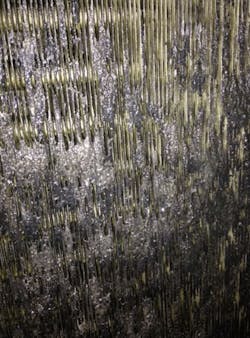 Figure (6): A view of the downstream face of the fouled chilled water coil within the air handling unit. This coil airside was completely plugged with fouling, with extruded fouling spilling out at the coil airside outlet. Figure (6): A view of the downstream face of the fouled chilled water coil within the air handling unit. This coil airside was completely plugged with fouling, with extruded fouling spilling out at the coil airside outlet.