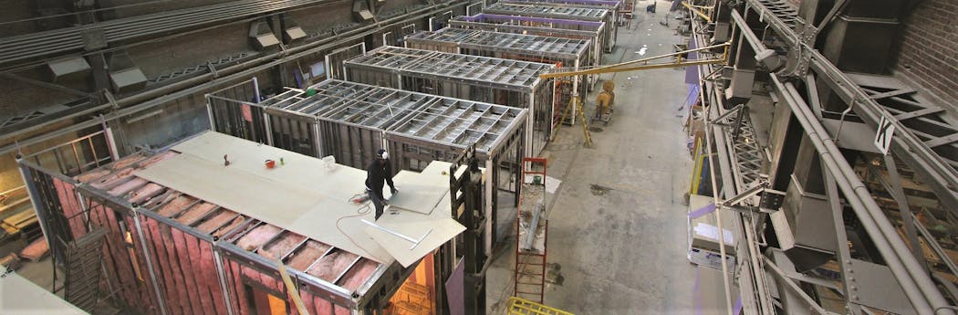 Crews at FullStack Modular&rsquo;s 100,000-sq-ft factory in the Brooklyn Navy Yard make sure all components fit before they are shipped.