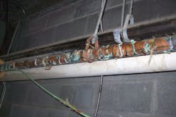 Figure (3): A view of another failed copper domestic water piping system at another jail. This piping system had failed beyond repair and was replaced with a plastic domestic water piping system at a cost of $800,000.
