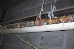 Figure (3): A view of another failed copper domestic water piping system at another jail. This piping system had failed beyond repair and was replaced with a plastic domestic water piping system at a cost of $800,000. Figure (3): A view of another failed copper domestic water piping system at another jail. This piping system had failed beyond repair and was replaced with a plastic domestic water piping system at a cost of $800,000.