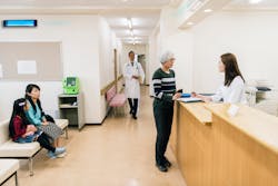 Glo Receptionist In Hospital Waiting Area Glo Receptionist In Hospital Waiting Area