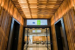 At the main elevator bank, employees are greeted by screens showing real-time statistics measuring the building&rsquo;s sustainability and efficiency.