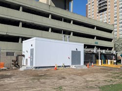 Each of the eight EnviroSep modular plants services a mechanical room in an adjacent parking garage surrounded by a cluster of high-rises.