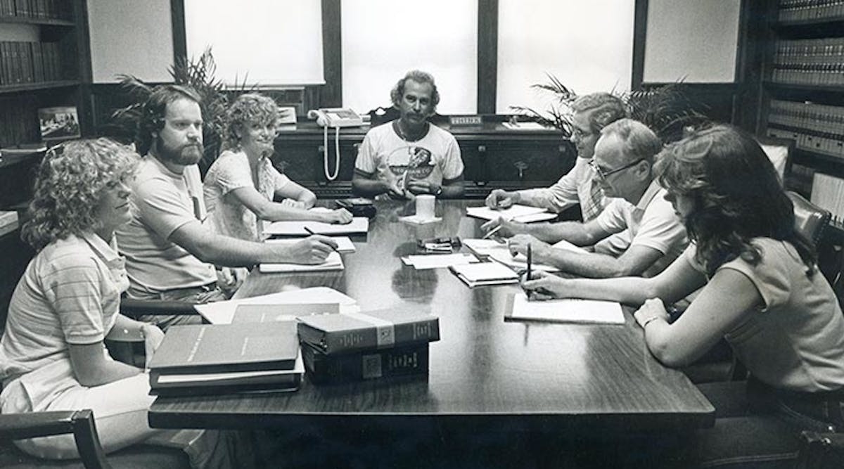 Jimmy Buffett (center) chairs an early meeting of the Save the Manatee Committee.