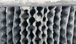 BEFORE: Data center cooling tower fill with major scaling issues before cleaning technology was applied. BEFORE: Data center cooling tower fill with major scaling issues before cleaning technology was applied.