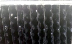 AFTER: Same cooling tower fill after cleaning technology was applied. AFTER: Same cooling tower fill after cleaning technology was applied.