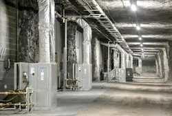 Originally, air-cooled packaged systems were chosen to condition the leased space underground – with ductwork arranged along walls in the cave. Originally, air-cooled packaged systems were chosen to condition the leased space underground – with ductwork arranged along walls in the cave.