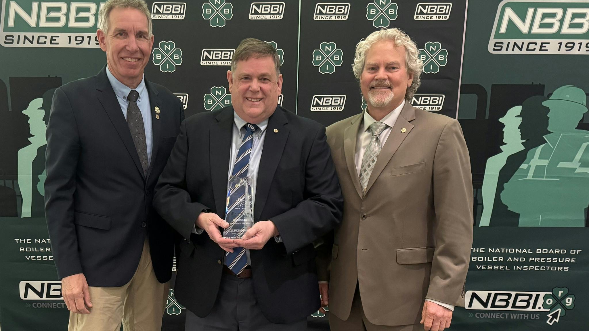 John Burpee was honored during the banquet as the 34th recipient of the C.O. Myers Safety Award, the National Board&rsquo;s highest honor. He was presented with the award by Eben Creaser (left) and Joel Amato.